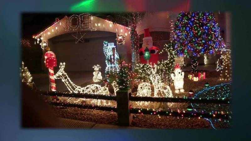A Gilbert home decorated in Christmas lights and displays at night.