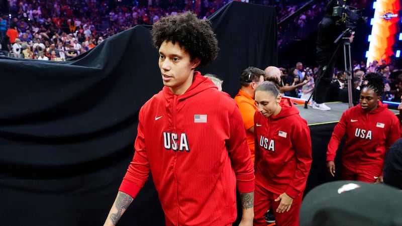 Brittney Griner, left, Diana Taurasi, and Chelsea Gray, of Team USA, walk on the court prior...